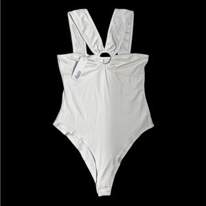 GLAM - center ring crossover off white bodysuit. Size small NWT